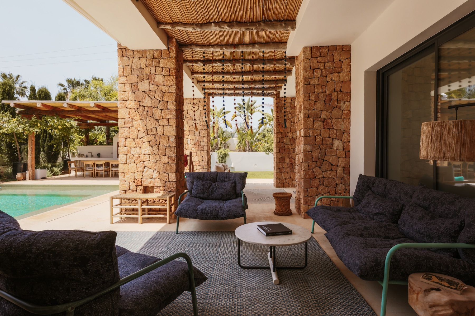 Shaded salon beside the pool at Casa Sargamasa